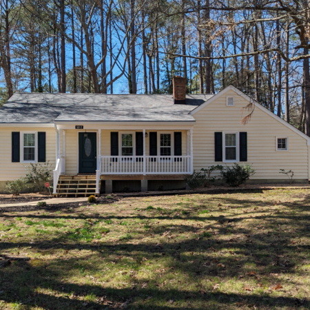 front view of a single story beige house