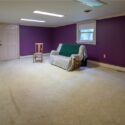 A rec room with a purple wall